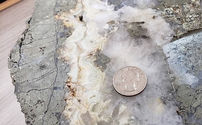 Jimenez and El Guadual show epithermal textures of symmetrical quartz banding and open space and bladed quartz. This later epithermal phase overprints two earlier phases of mesothermal mineralization and may explain the relatively higher-grade gold and enriched silver in this area. (CNW Group/Outcrop Silver & Gold Corporation)