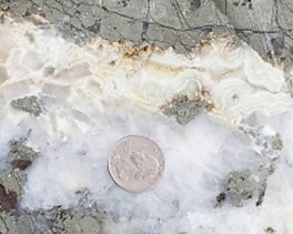 Jimenez and El Guadual show epithermal textures of symmetrical quartz banding and open space and bladed quartz. This later epithermal phase overprints two earlier phases of mesothermal mineralization and may explain the relatively higher-grade gold and enriched silver in this area. (CNW Group/Outcrop Silver & Gold Corporation)